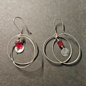 Silver tone earrings with red glass bead